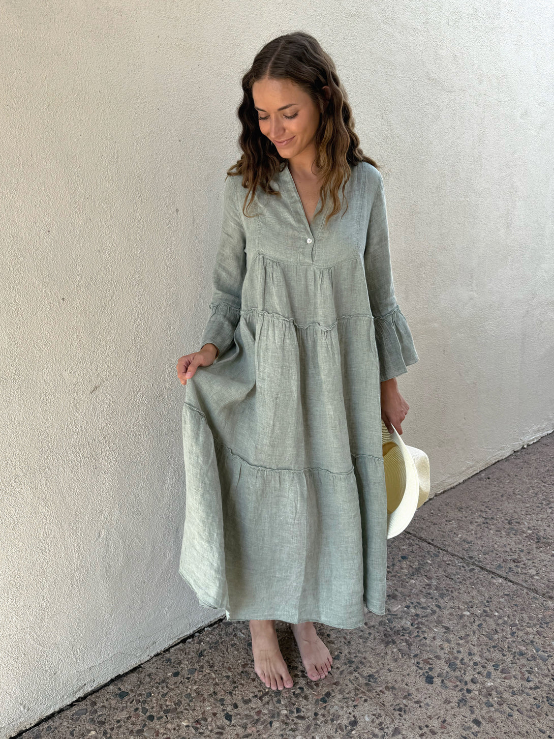 Conscious Coterie Adele Dress in Sage on model looking down full front view