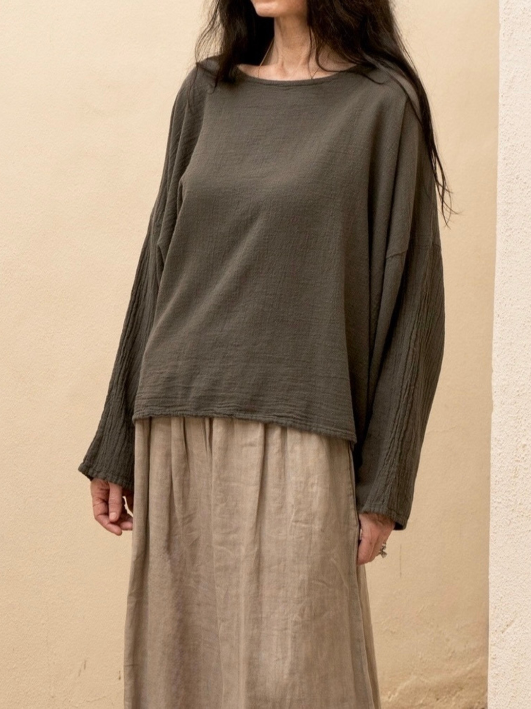 Conscious Coterie Alyssa top in charcoal grey close up photo of top on woman showing the front of the top