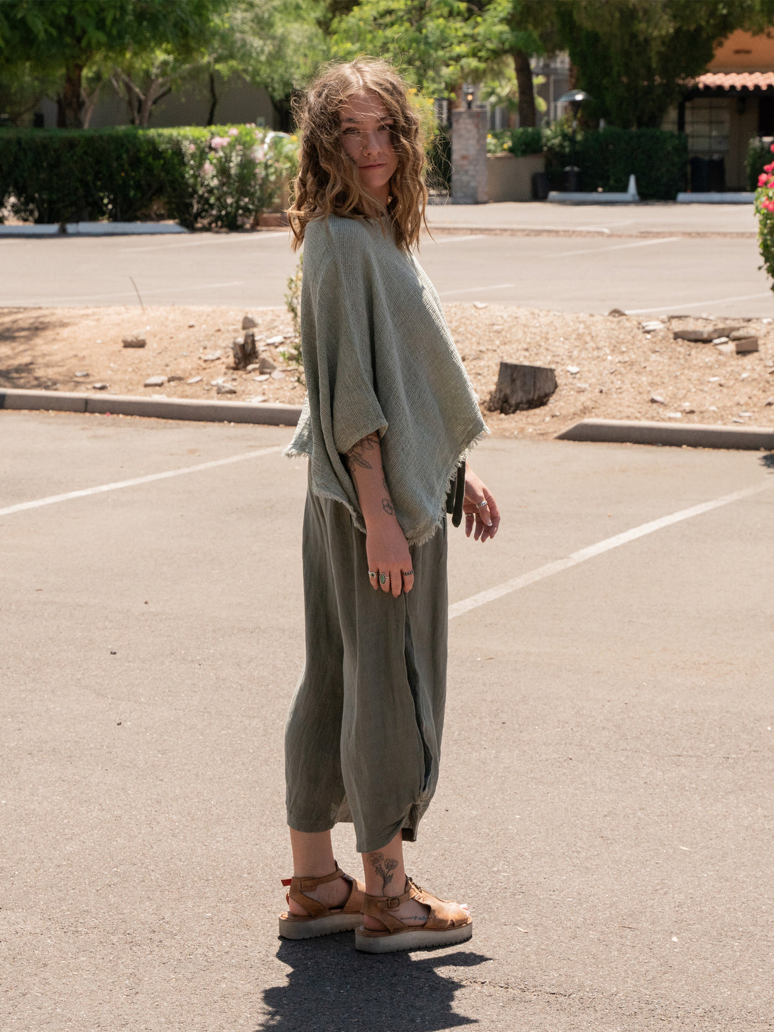 Conscious Coterie Bondi Linen Top in Olive on model looking right full side view