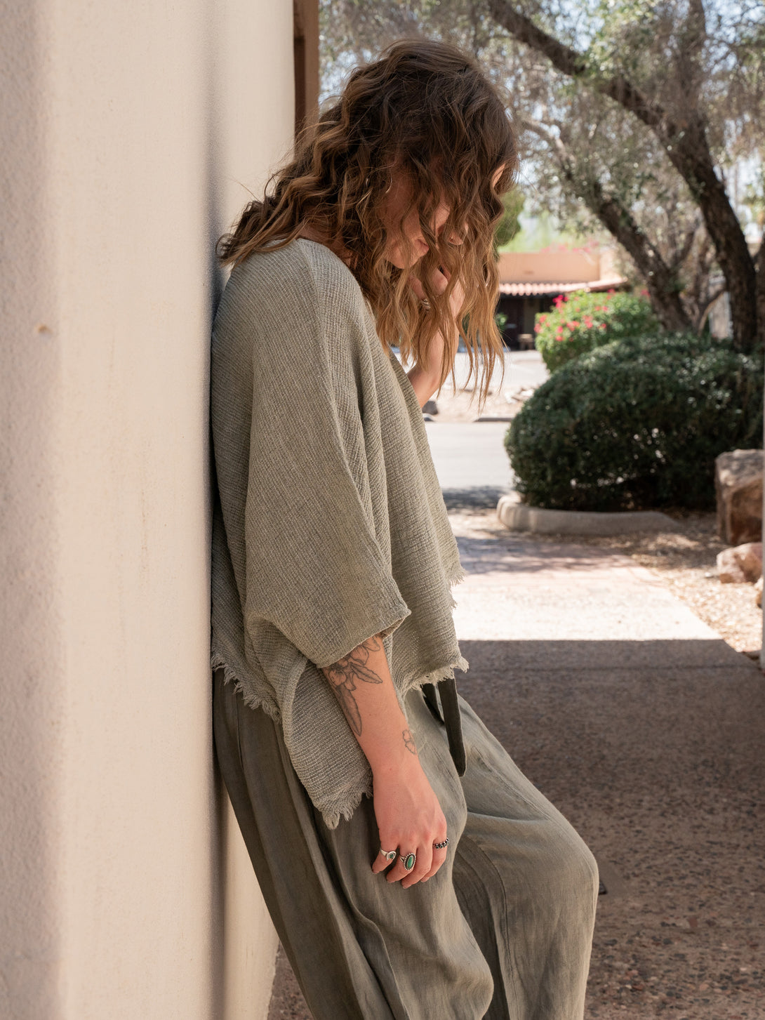 Conscious Coterie Bondi Linen Top in Olive on model side view