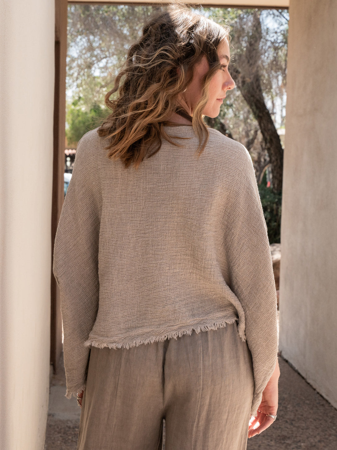 Conscious Coterie Bondi Linen Top in Taupe on model back view