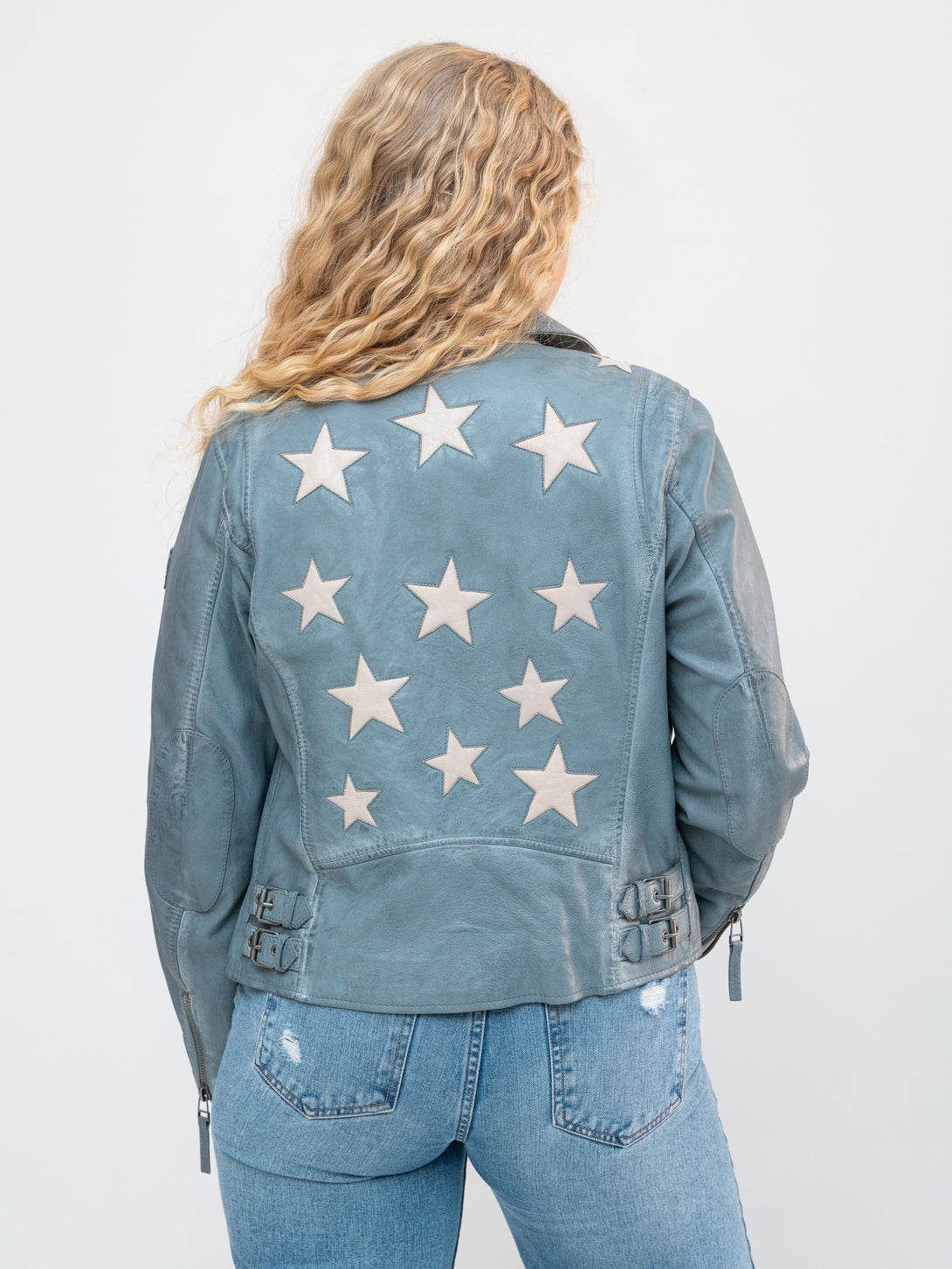 Conscious Coterie Christy Star leather jacket in winter sky blue on model back view