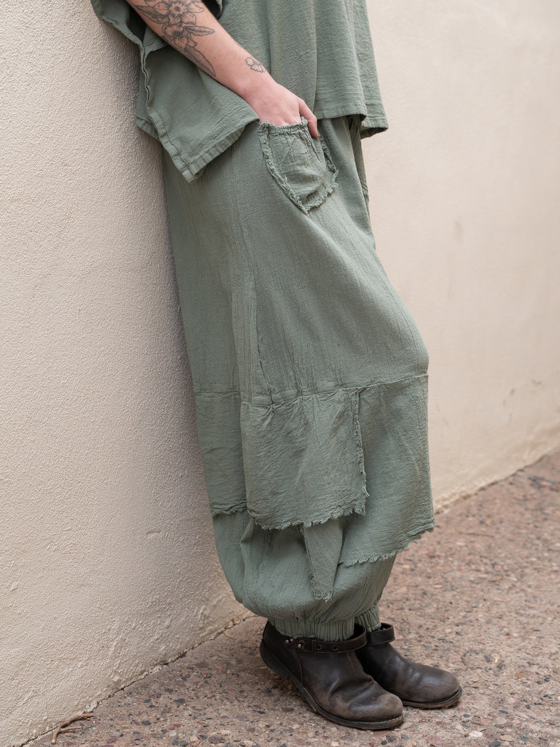 Conscious Coterie Dolly Pant in sage cotton on model side view
