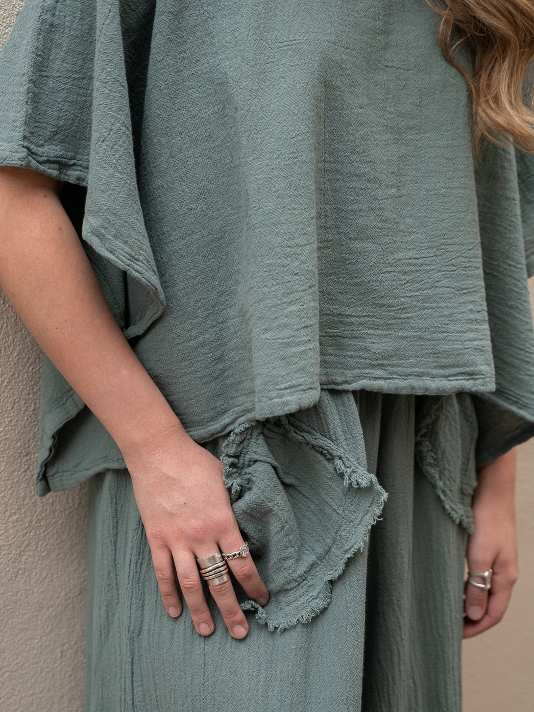 Conscious Coterie Dolly Pant in sea cotton on model front detail view