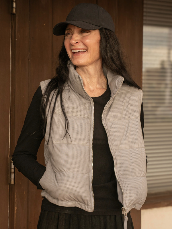 Conscious Coterie Ellice leather vest in light blue close up front view of puffer vest unzipped