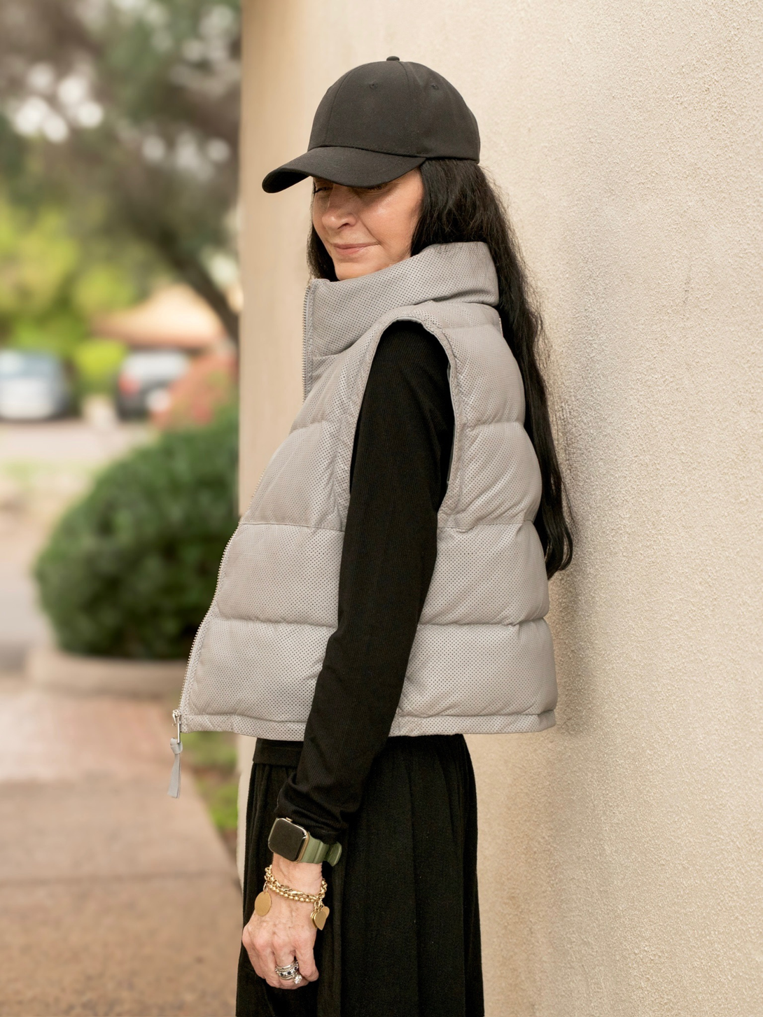 Conscious Coterie Ellice leather vest in light blue side view of puffer vest on model with her arm down to her side