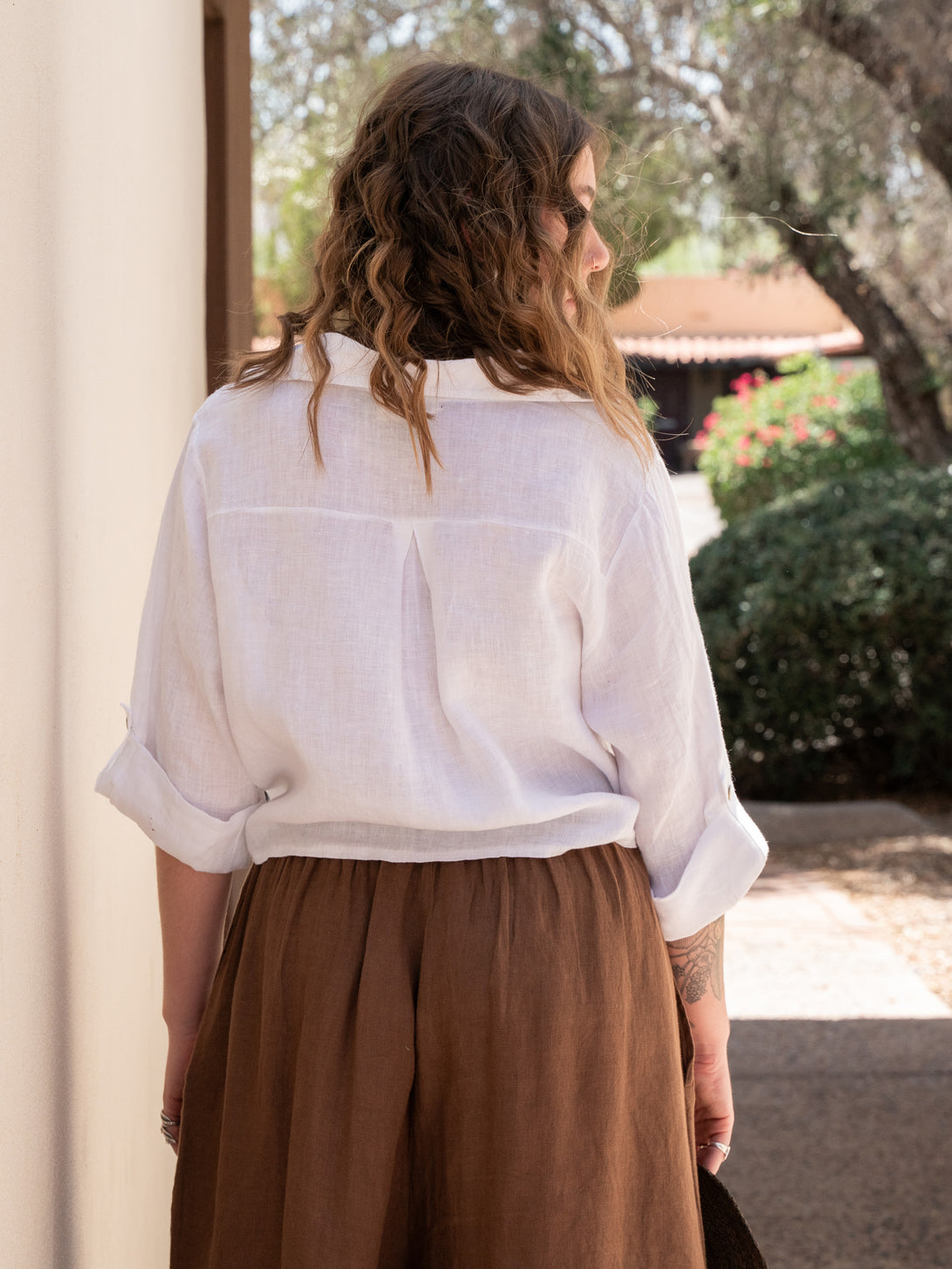 Conscious Coterie Jodi Linen Top in White on model back view