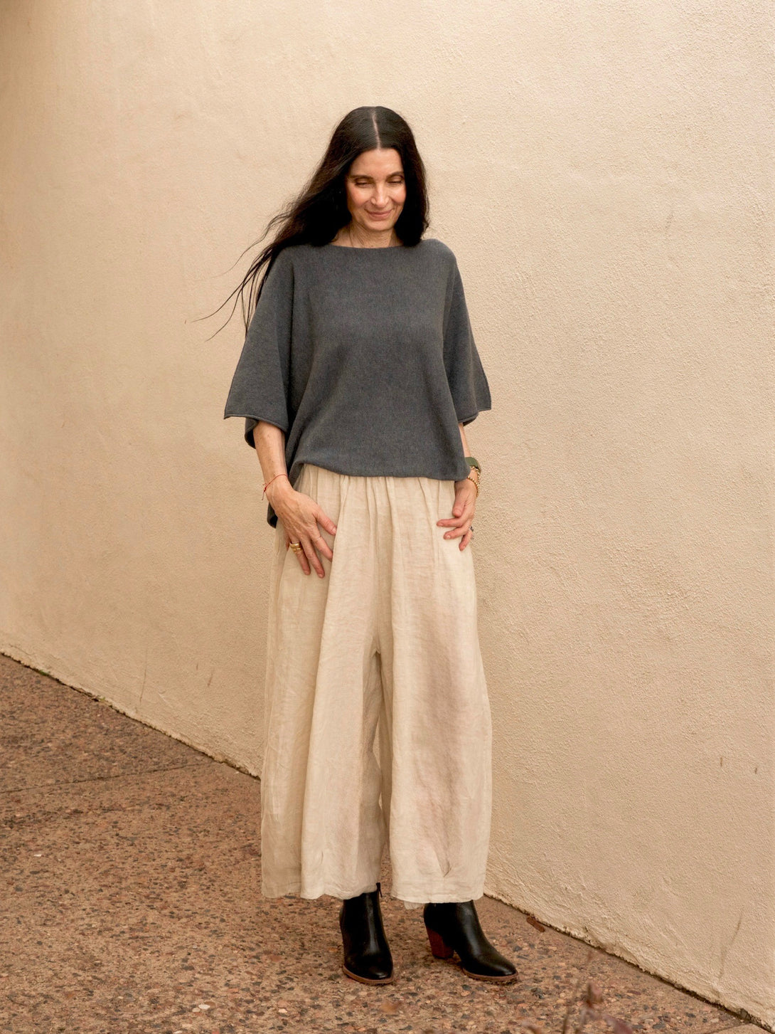 Conscious Coterie Katie Short Sleeve Sweater in charcoal on model looking down full front view