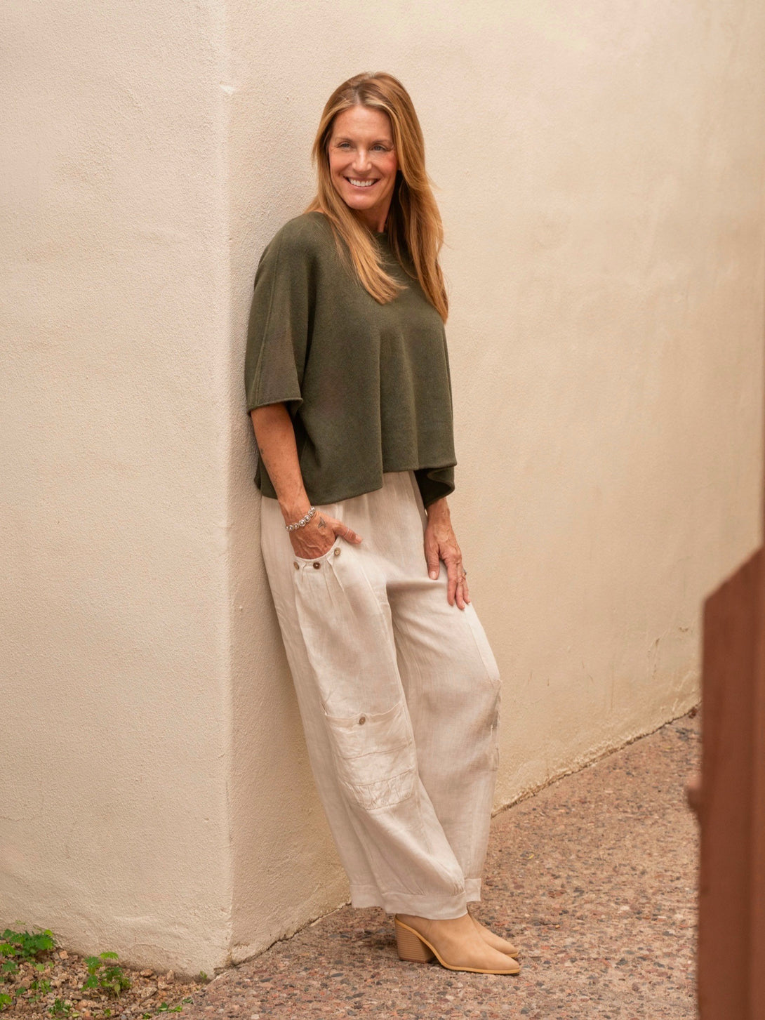 Conscious Coterie Katie Short Sleeve Sweater in olive on model full side view