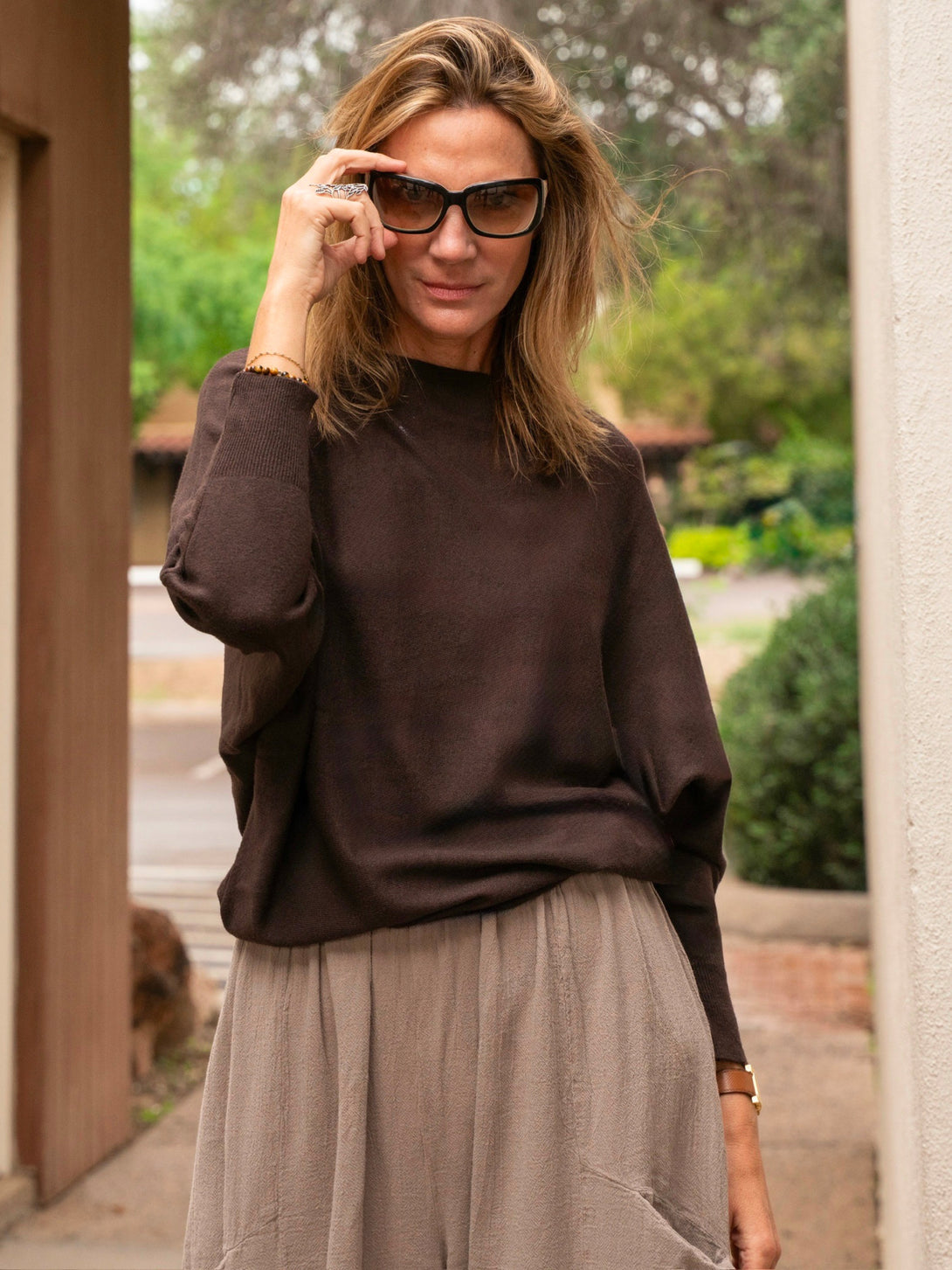 Conscious Coterie Kayla Long Sleeve Sweater in dark brown on model front view