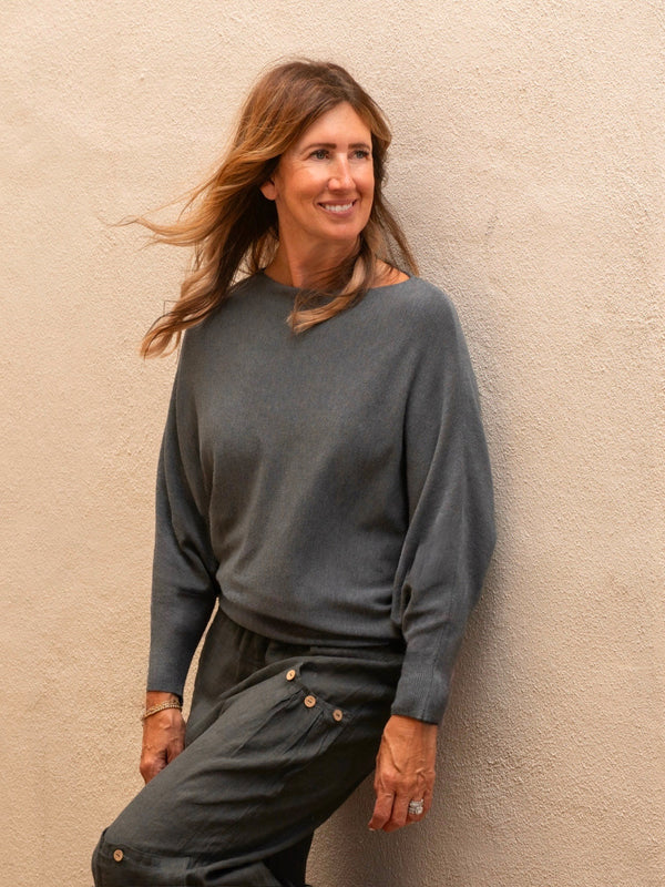 Conscious Coterie Kayla Long Sleeve Sweater in charcoal on model looking left front view