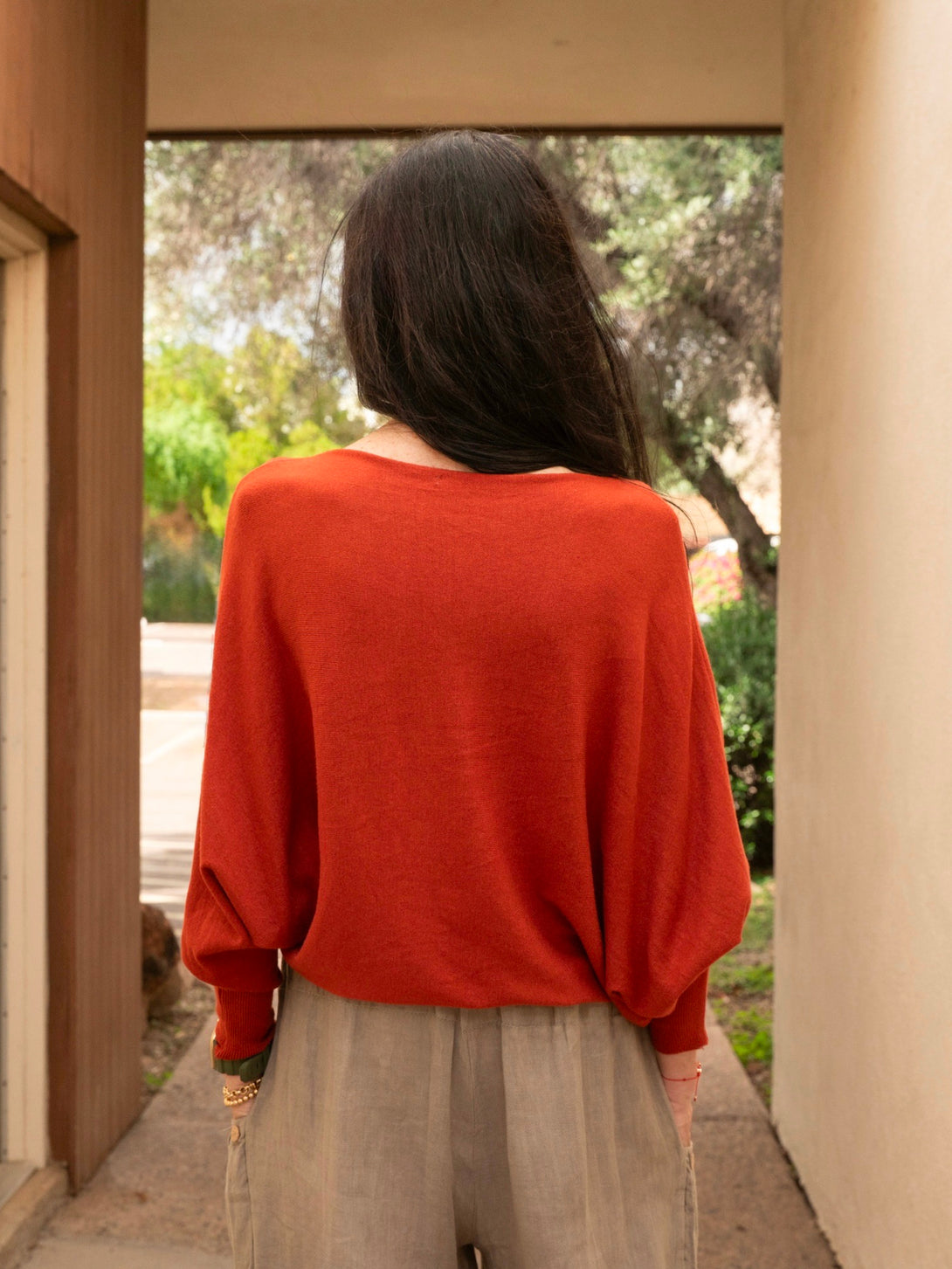Conscious Coterie Kayla Long Sleeve Sweater in rust on model back view