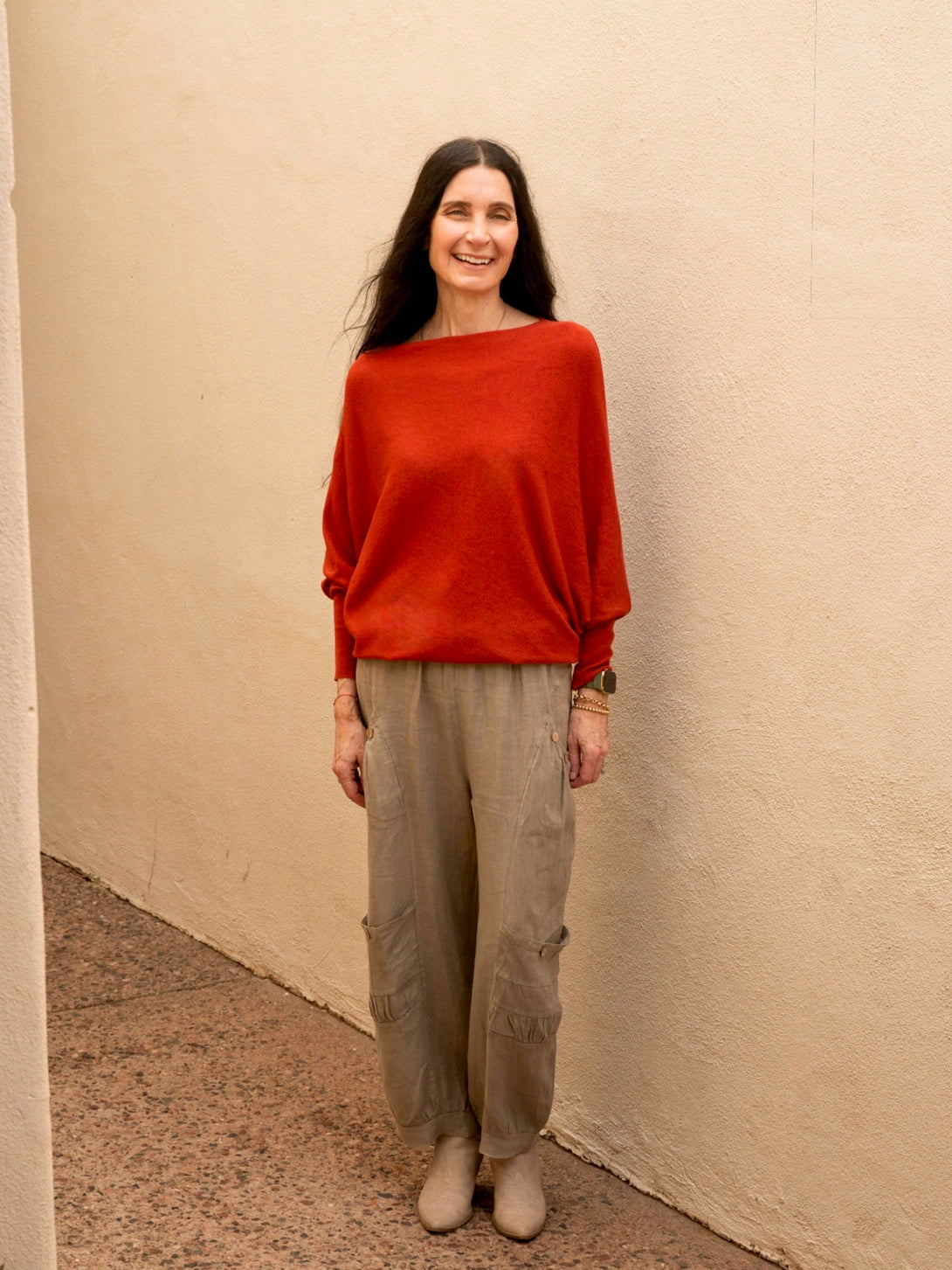 Conscious Coterie Kayla Long Sleeve Sweater in rust on model laughing full front view