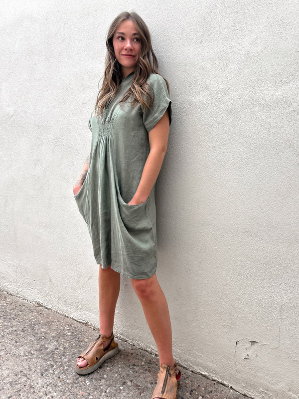 Conscious Coterie Kimmie Dress in Olive on model looking left full front view