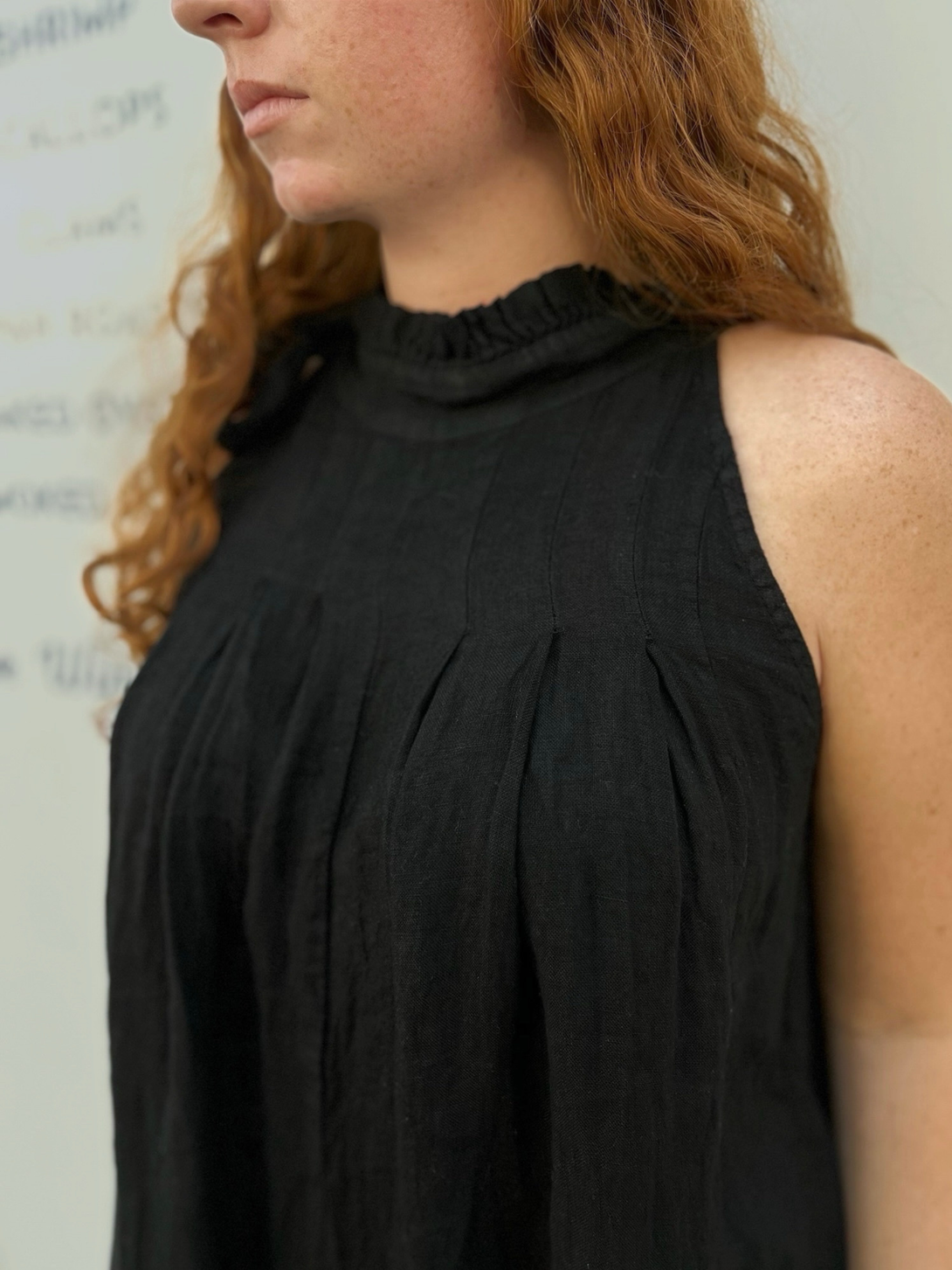 Conscious Coterie Kristen Jumpsuit in black detail photo of pleating on jumpsuit