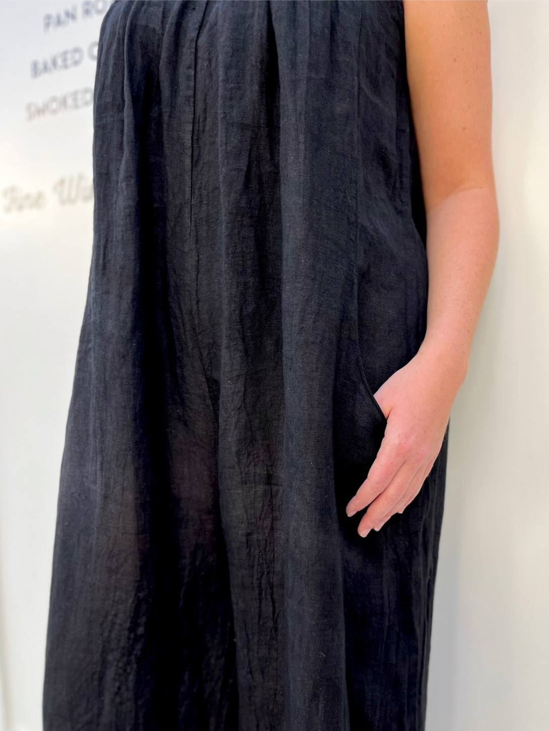 Conscious Coterie Kristen Jumpsuit in black close up view of pocket of jumpsuit