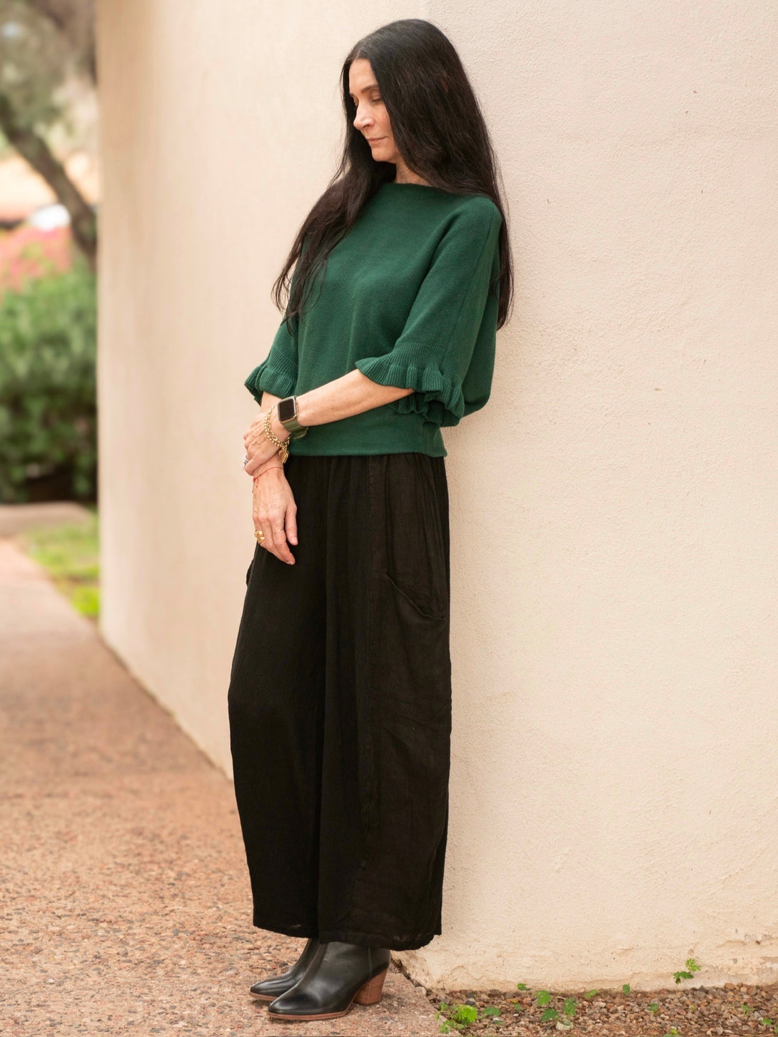 Conscious Coterie Lila Ruffle Sleeve Sweater in forest green on model full side view