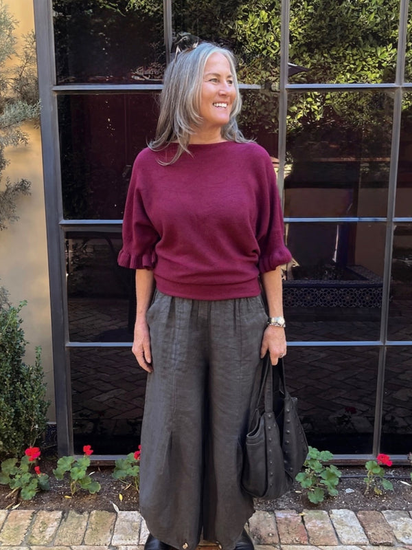 Conscious Coterie Lila Sweater in Burgundy front full body photo of sweater on woman smiling