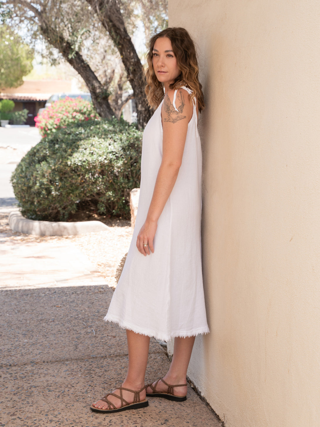 Conscious Coterie Lola Linen Dress in white on model full side view