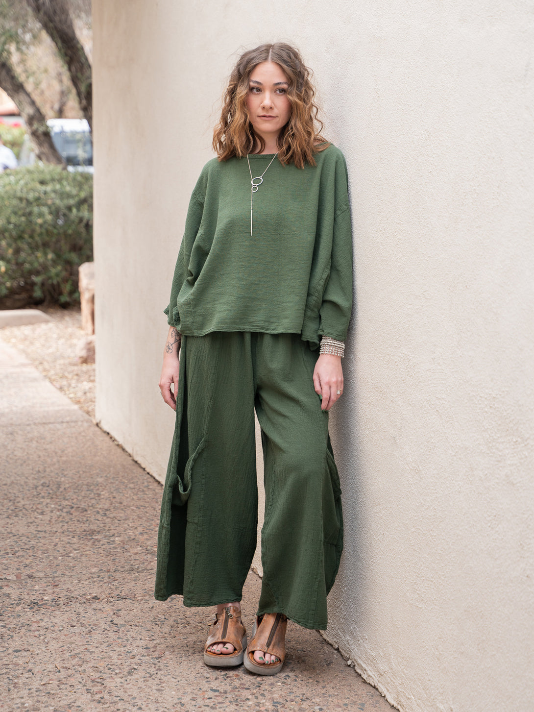 Conscious Coterie Lucy Pant in moss cotton on model full front view