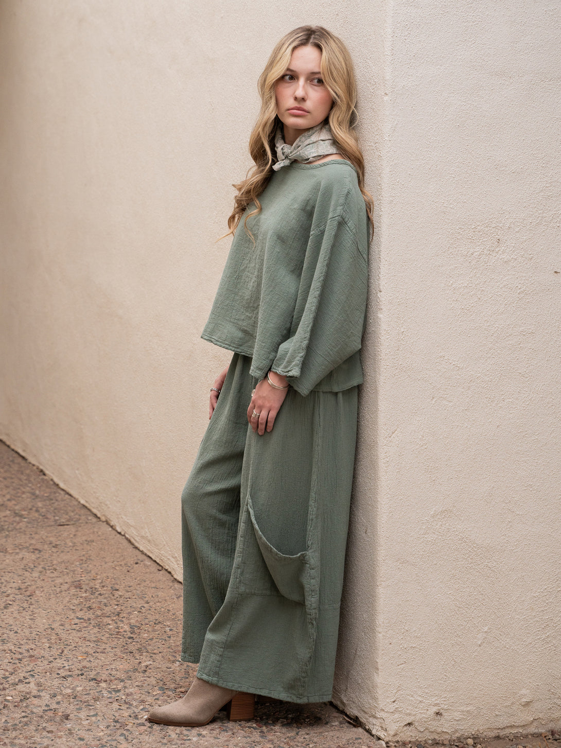 Conscious Coterie Lucy Pant in sage cotton on model looking left full side view