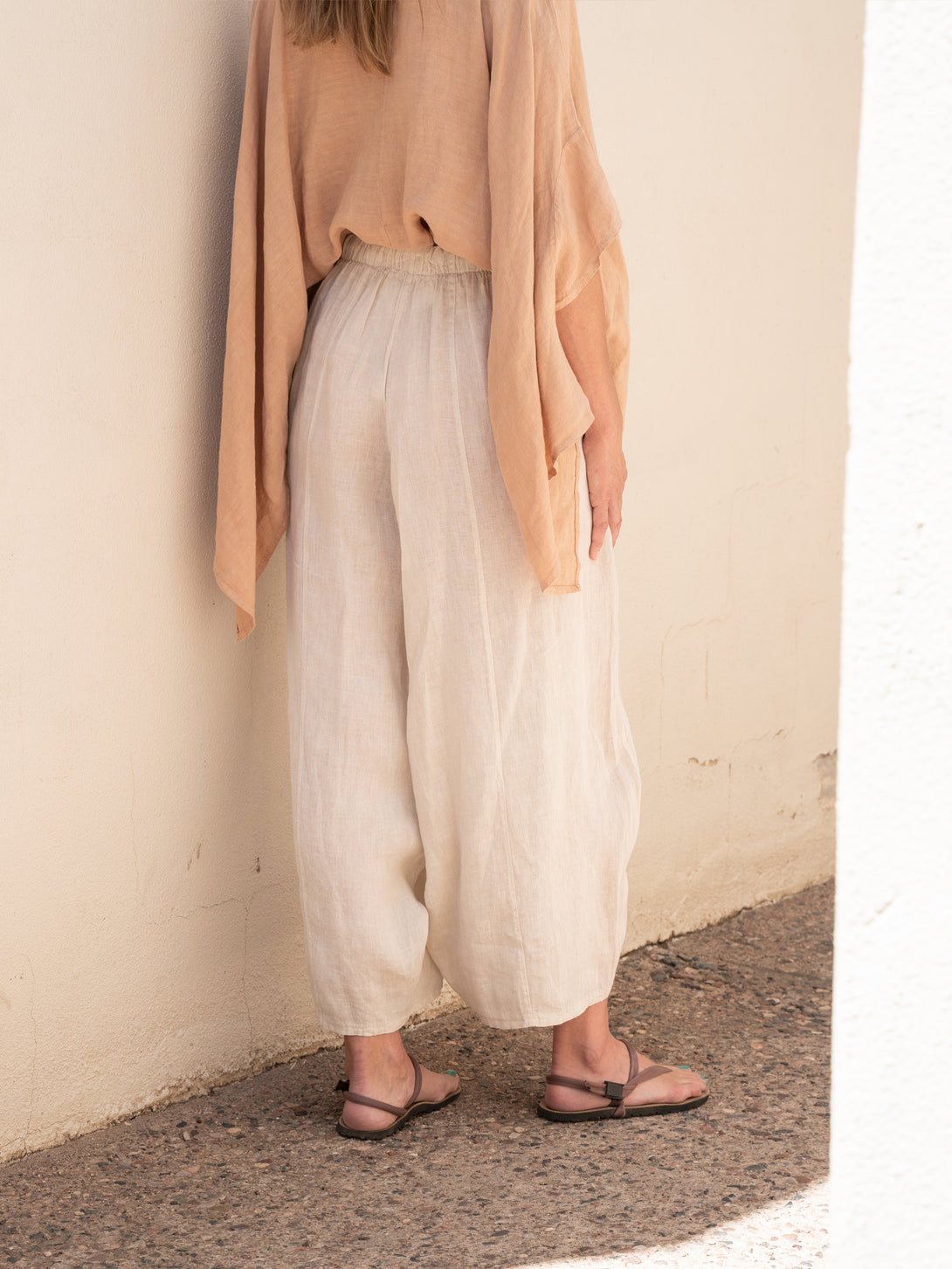 Conscious Coterie Mel Linen Pant in Beige on model back view