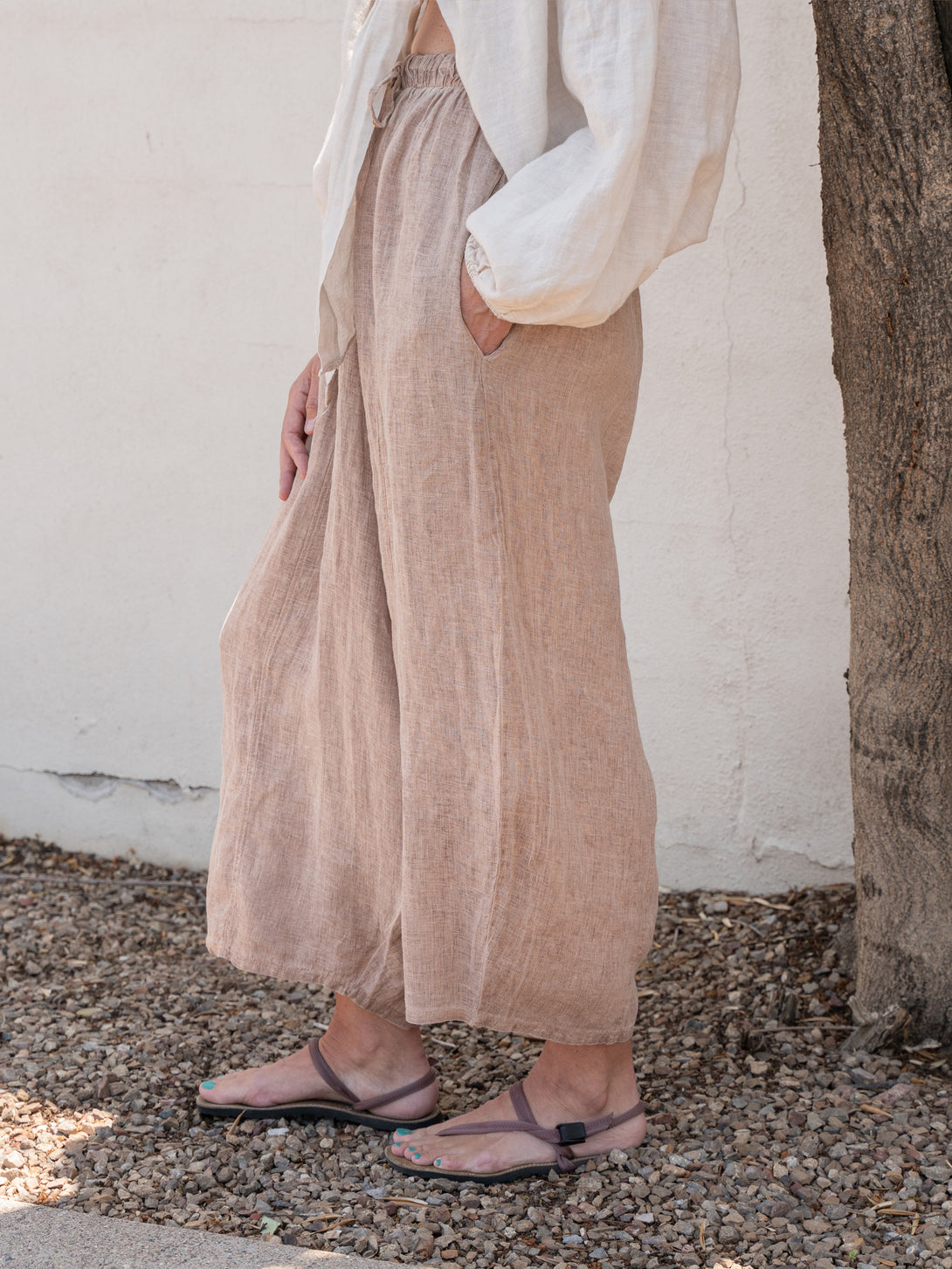 Conscious Coterie Mel Linen Pant in Brown on model side view