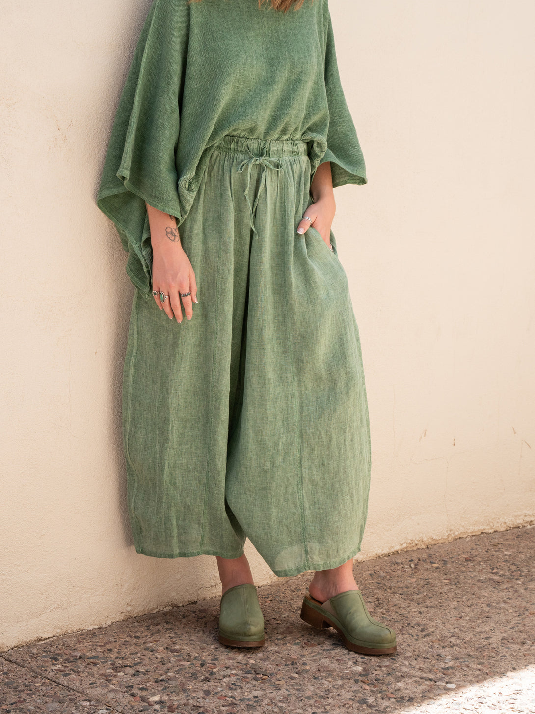 Conscious Coterie Mel Linen Pant in Forest Green on model front view