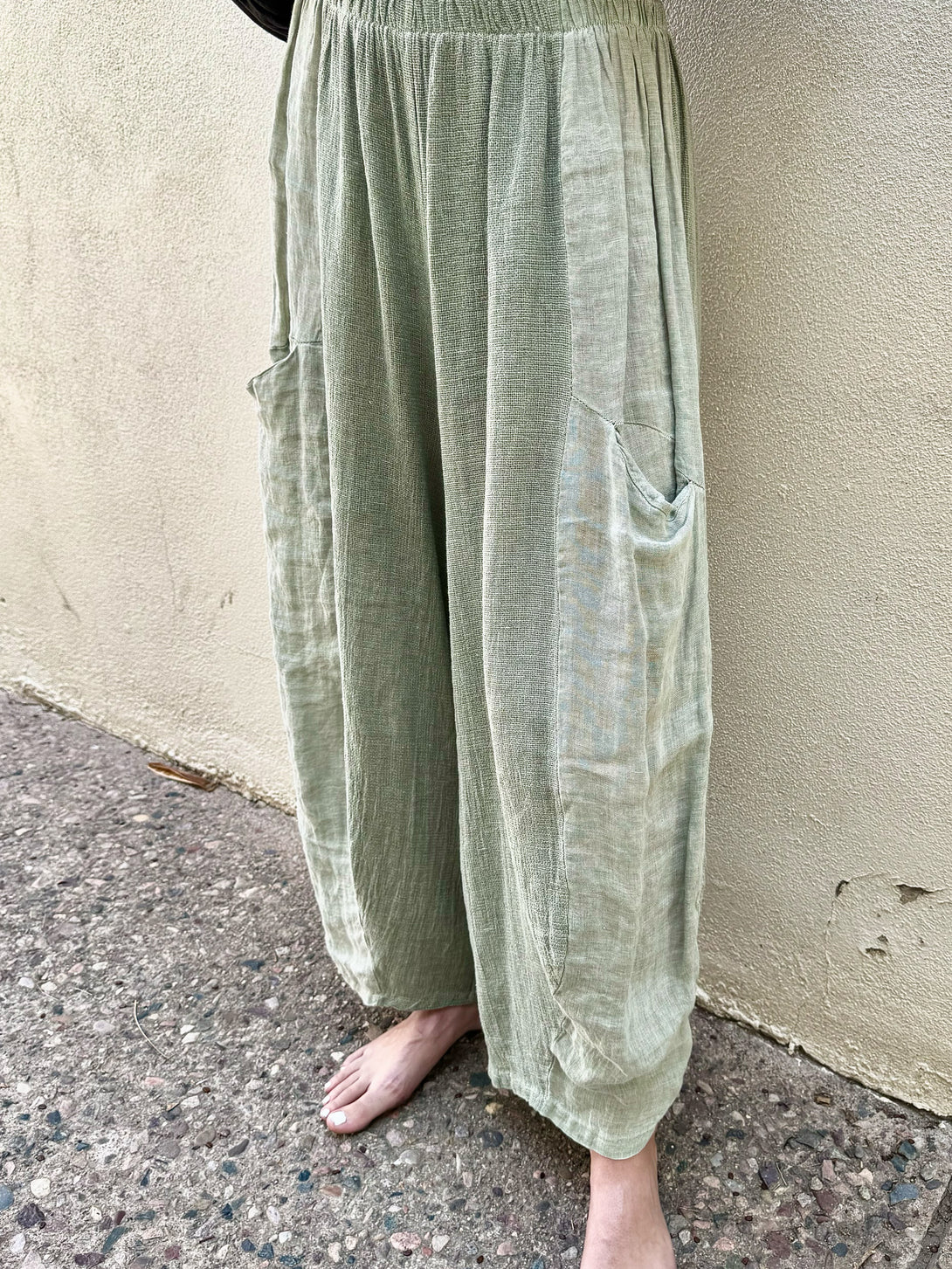 Conscious Coterie Michelle Pant in Olive on model front bottom detail view