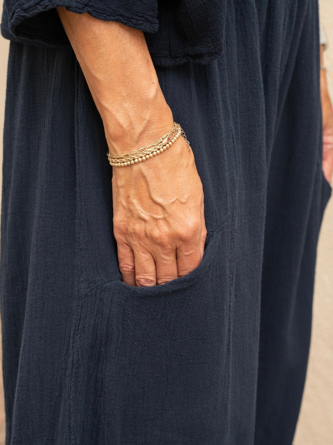 Conscious Coterie Mickey pant in navy blue close up photo of the pant pocket on model