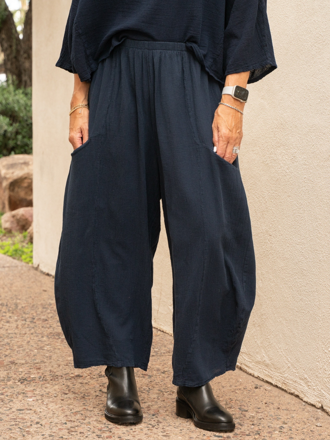 Conscious Coterie Mickey pant in navy blue showing just the pants with model in a wider stance