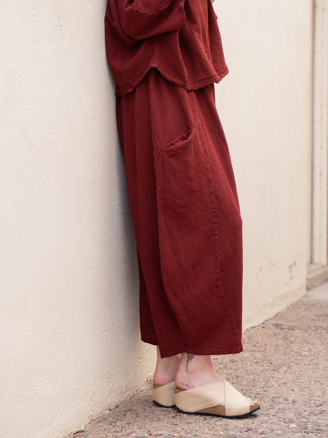 Conscious Coterie Mickey Pant in wine cotton on model side view
