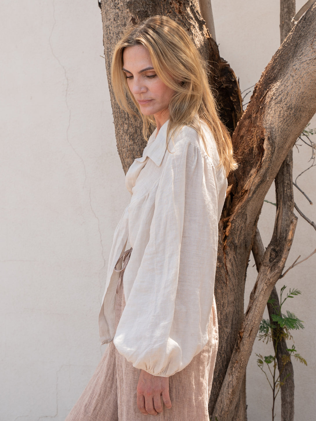 Conscious Coterie Miley Top in Beige on model looking down side view
