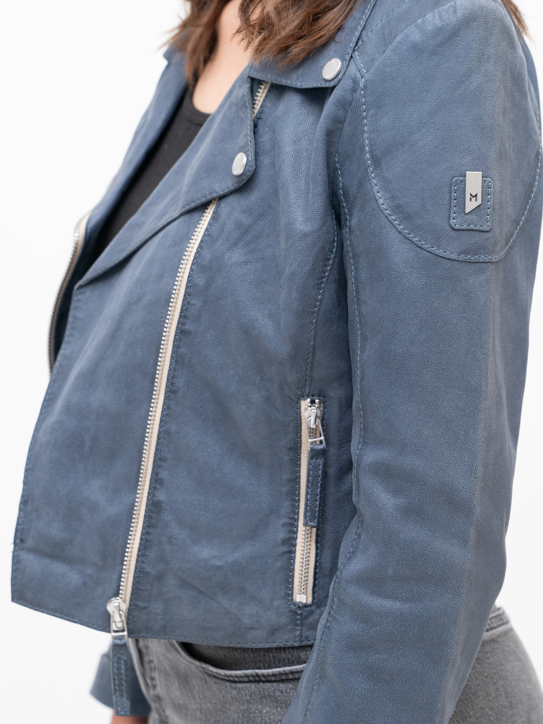 Conscious Coterie Reanon Leather Jacket in blue on model side view