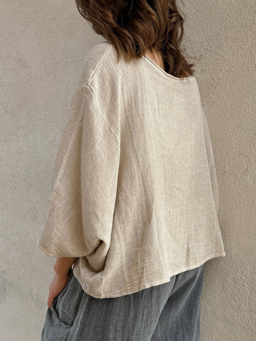 Conscious Coterie Rhonda Top in Beige on model backside side view