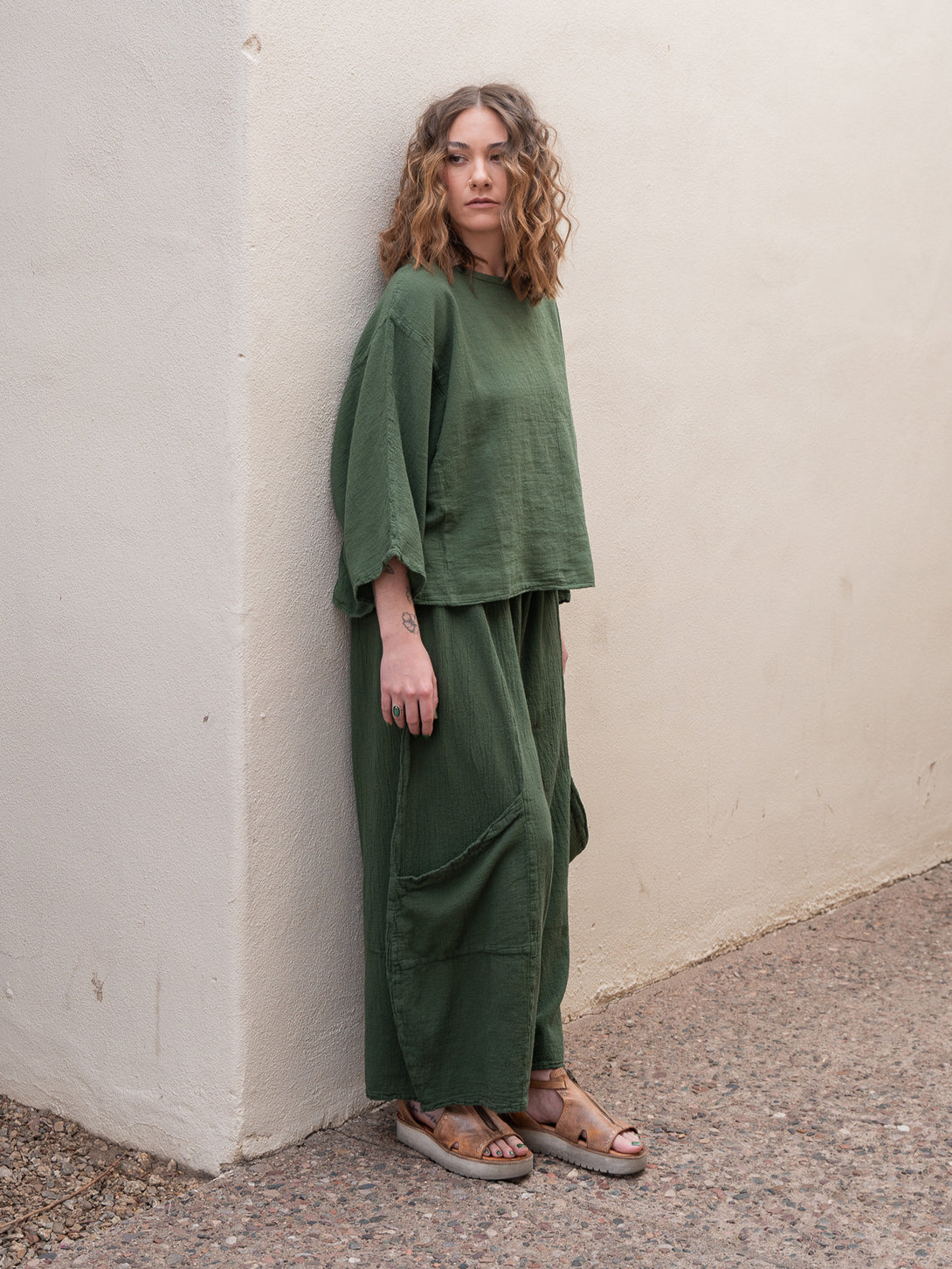 Conscious Coterie Rosie Top in moss cotton on model looking right full front side view
