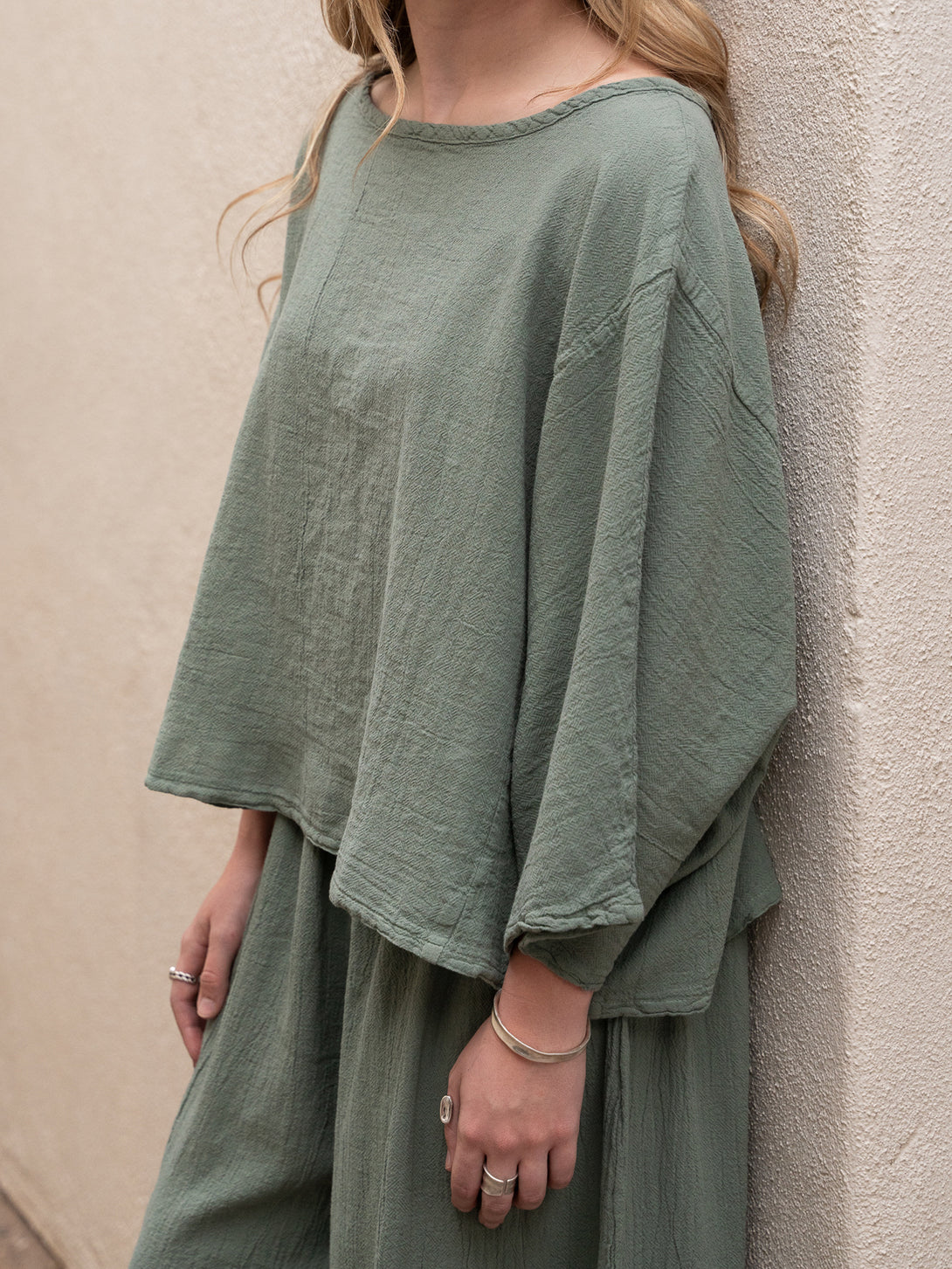 Conscious Coterie Rosie Top in sage cotton on model front side detail view