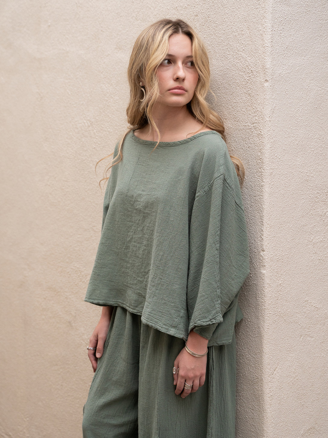 Conscious Coterie Rosie Top in sage cotton on model looking left side view