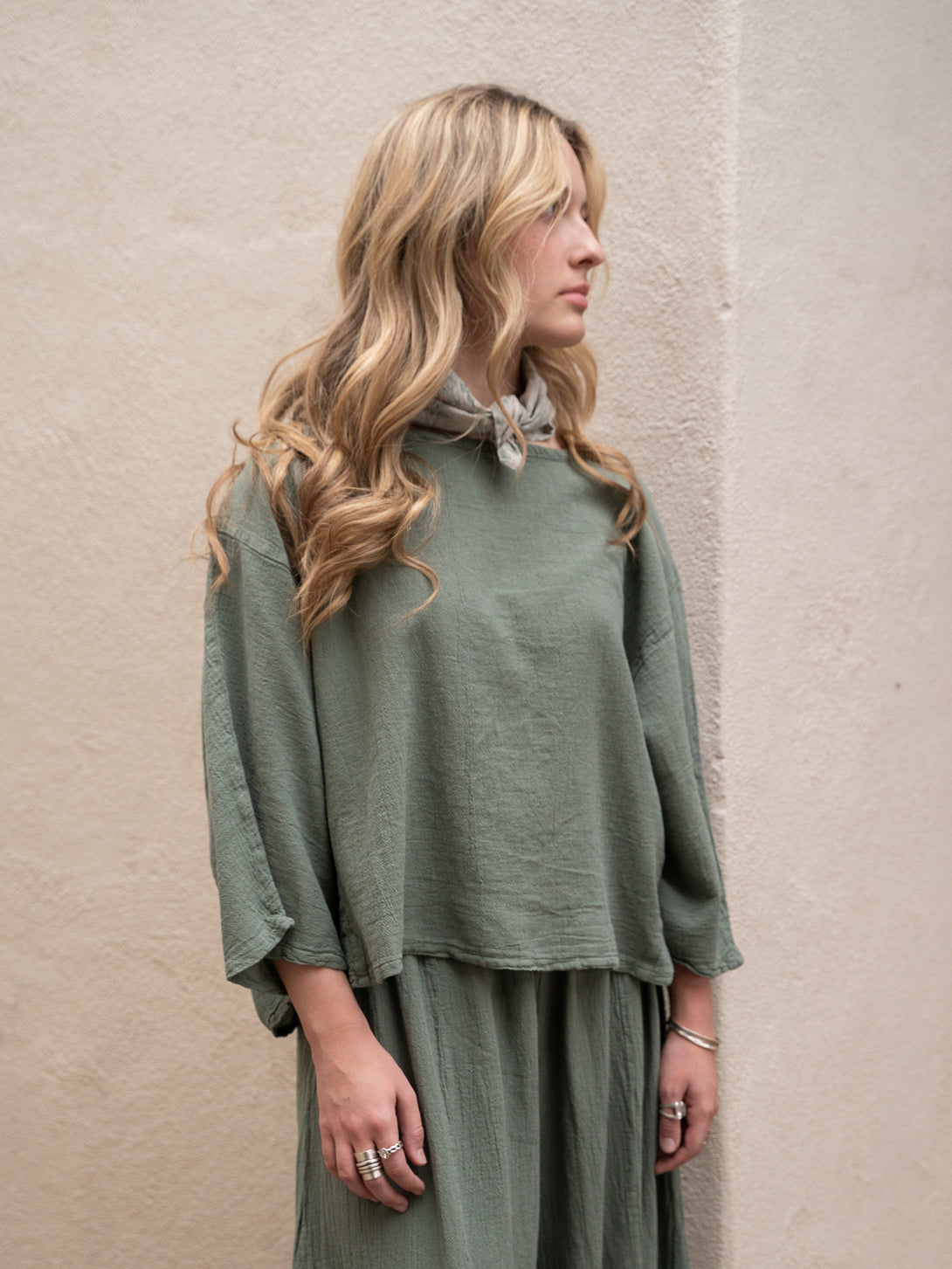 Conscious Coterie Rosie Top in sage cotton on model looking left front view