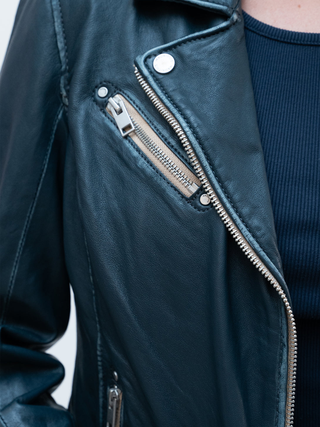 Conscious Coterie Sofia Leather Jacket in denim blue on model right lapel detail view