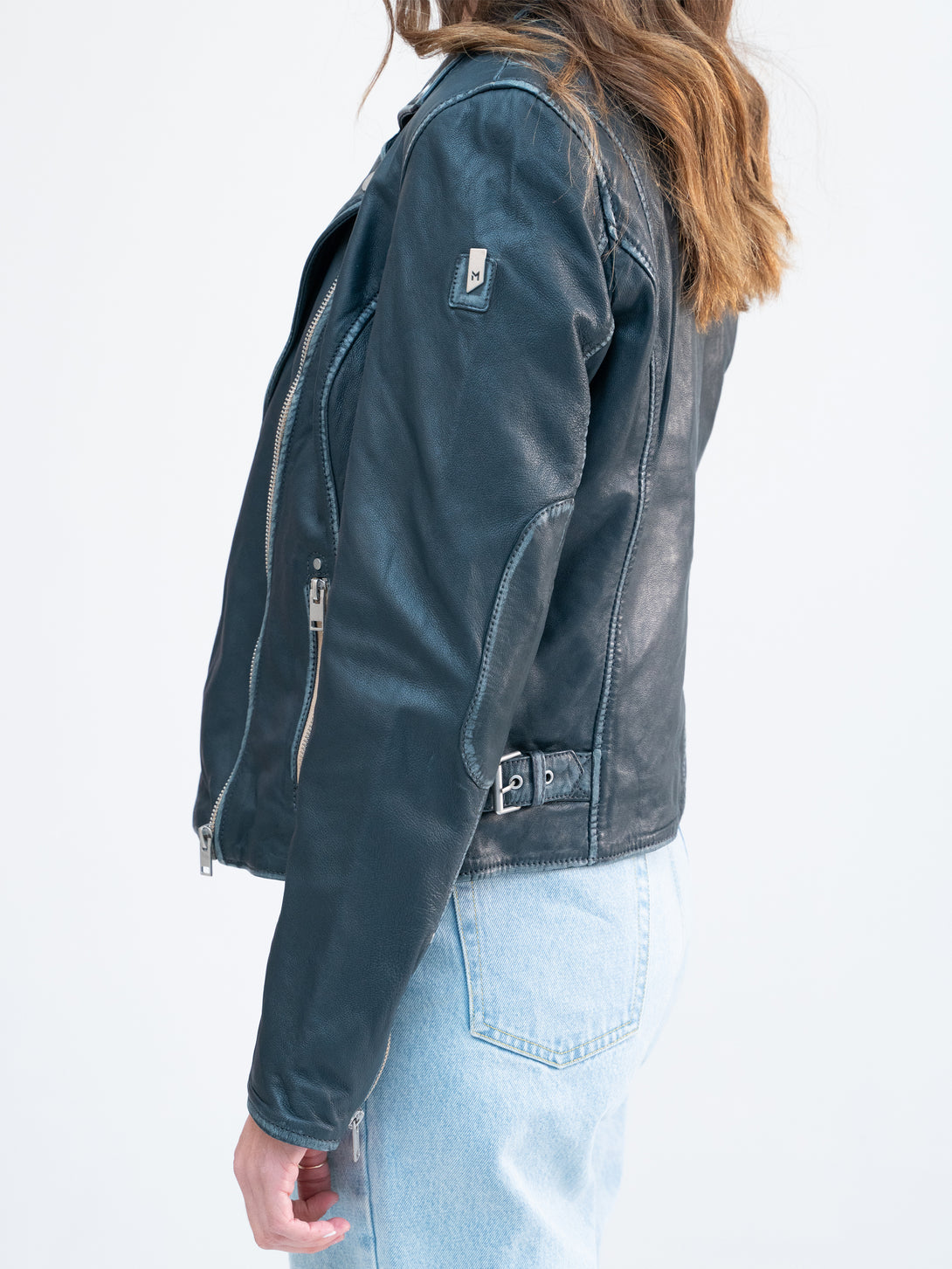 Conscious Coterie Sofia Leather Jacket in denim blue on model side view