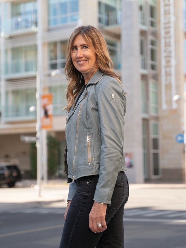 Conscious Coterie Sofia Leather Jacket in winter sky blue on model Dana looking left editorial image