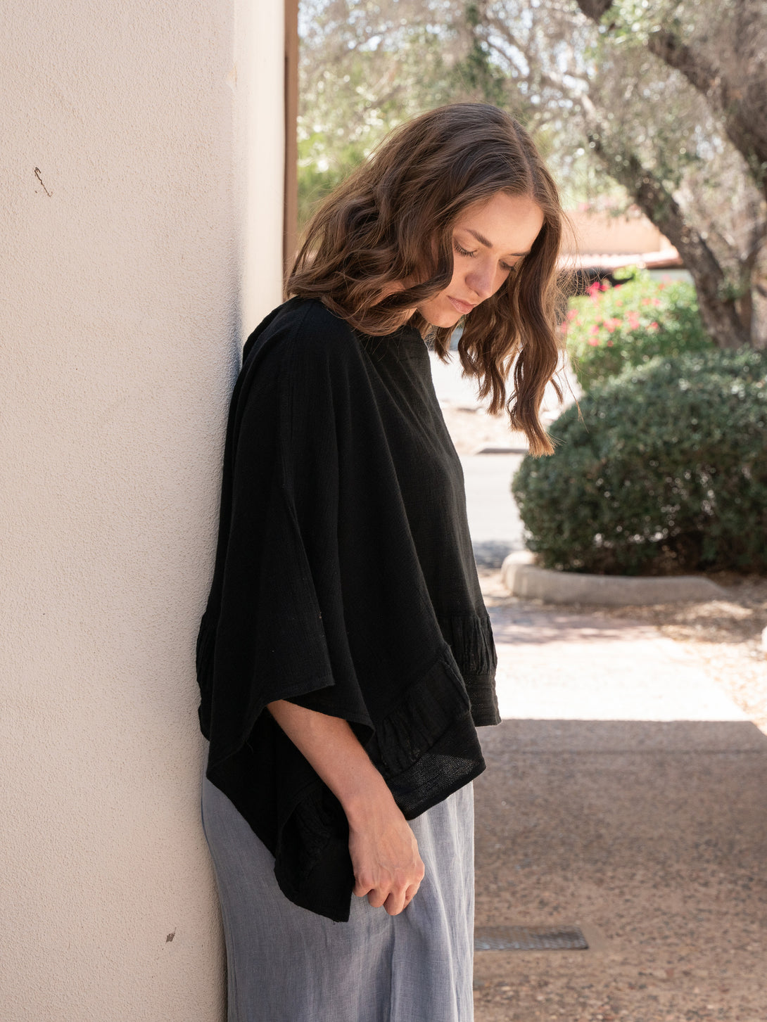 Conscious Coterie Tori Linen Top in Black on model side view