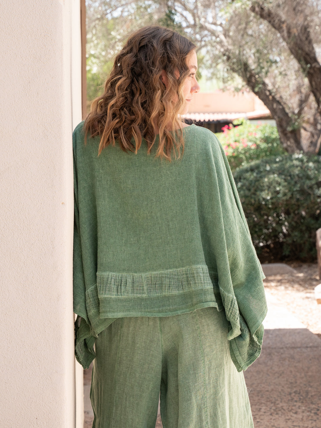 Conscious Coterie Tori Linen Top in Forest Green on model back view