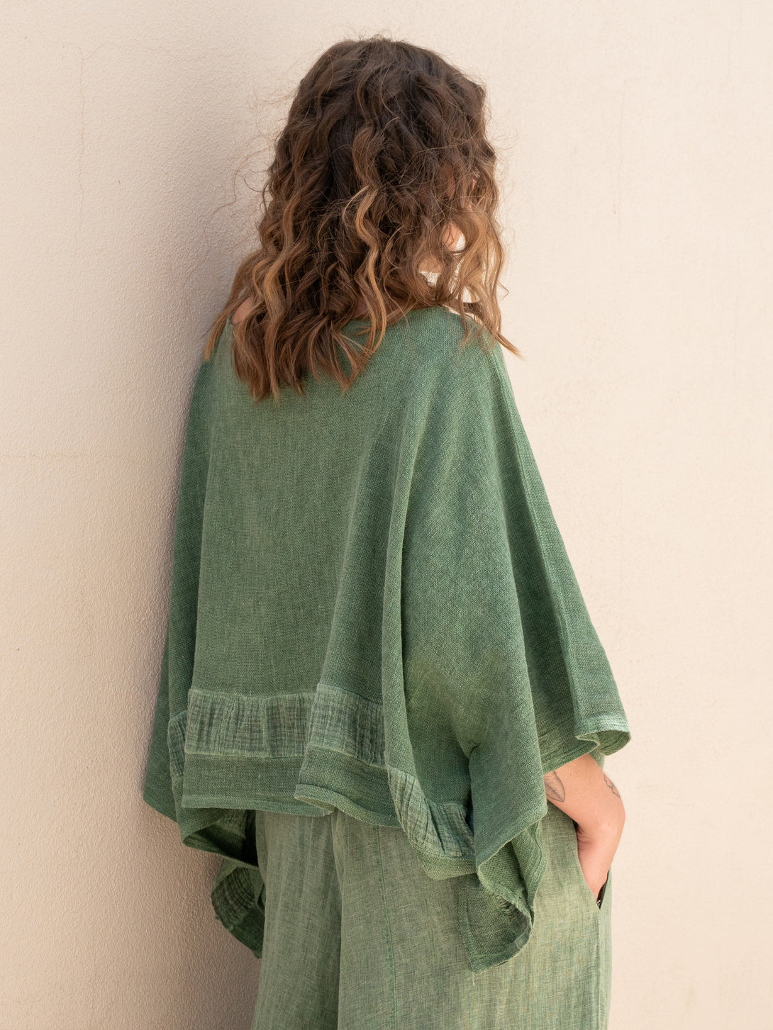 Conscious Coterie Tori Linen Top in Forest Green on model side view