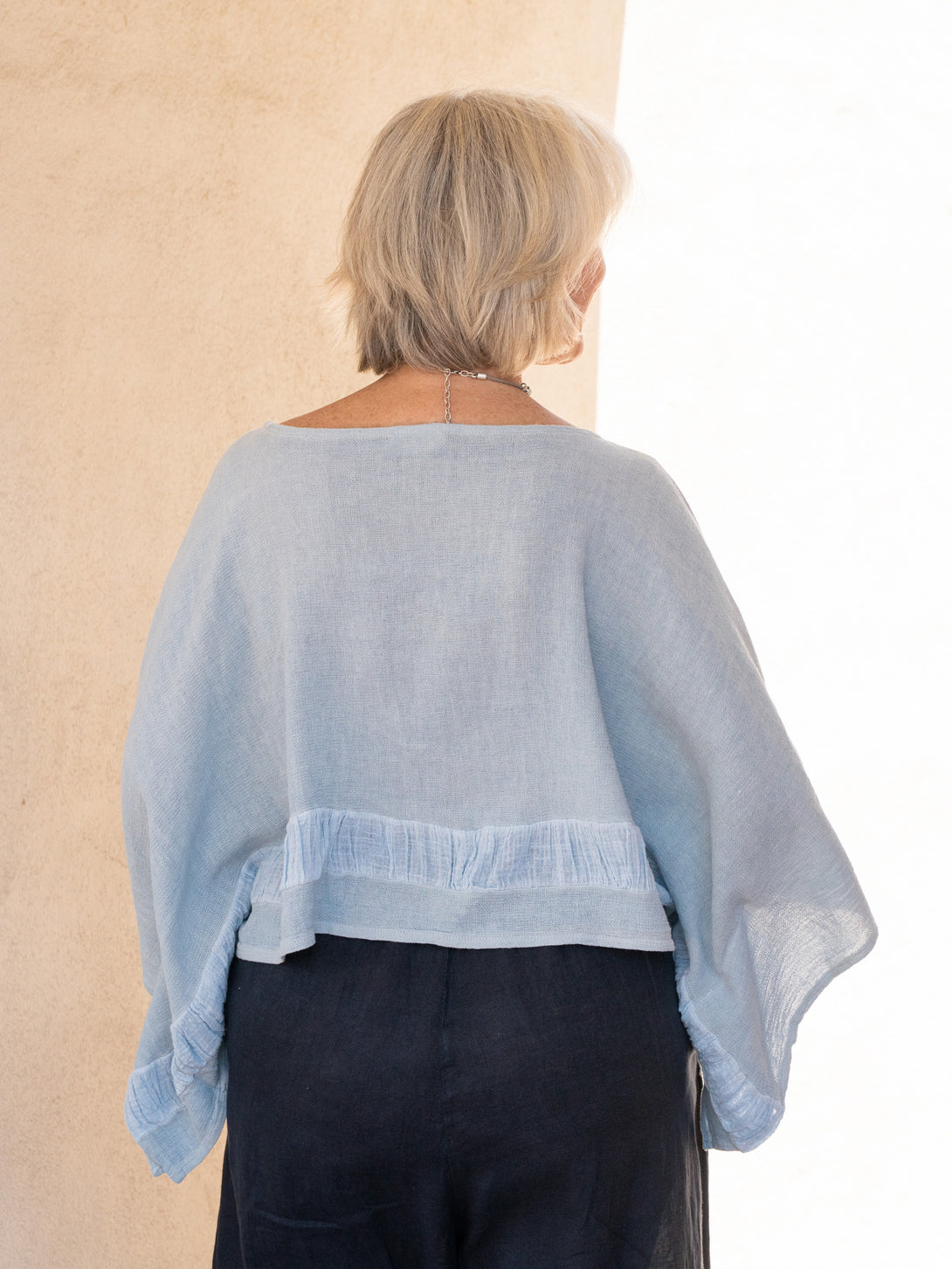 Conscious Coterie Tori Linen Top in Sky Blue on model back view