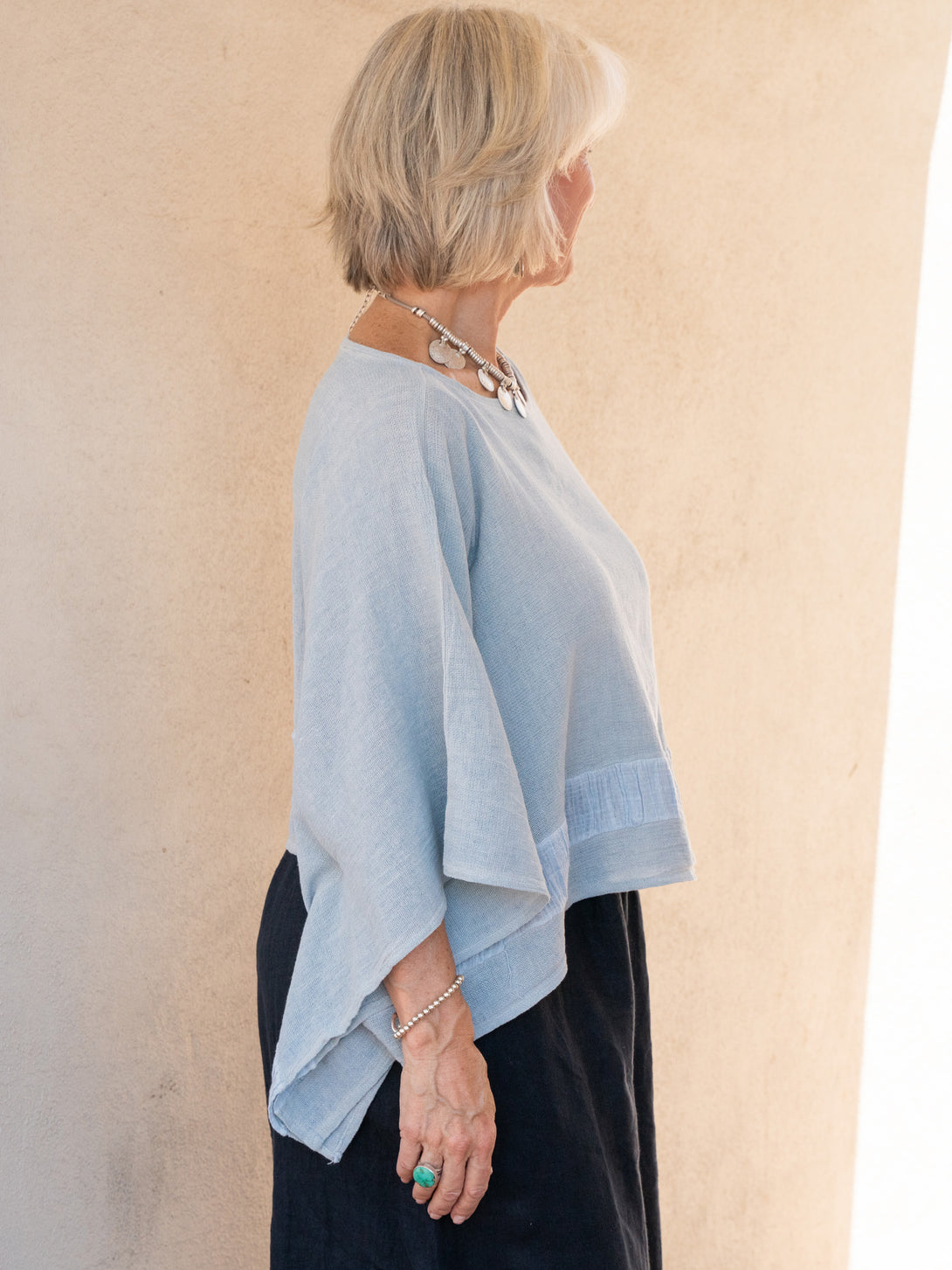 Conscious Coterie Tori Linen Top in Sky Blue on model side view