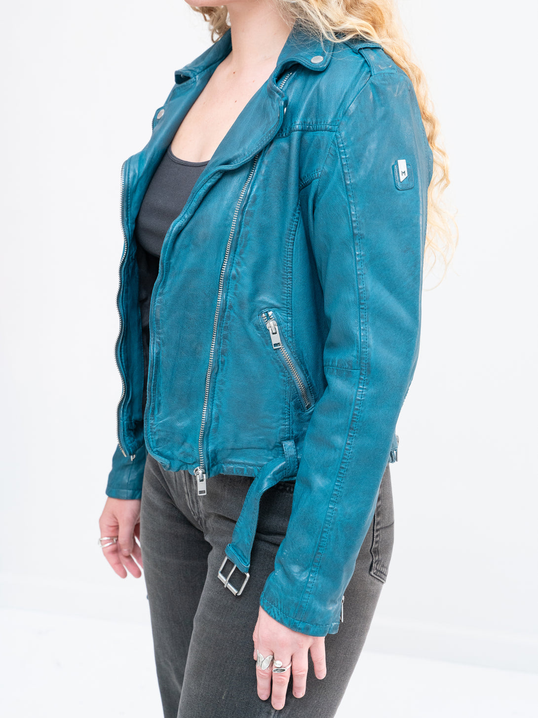 Conscious Coterie Wild Leather Jacket in teal on model side view