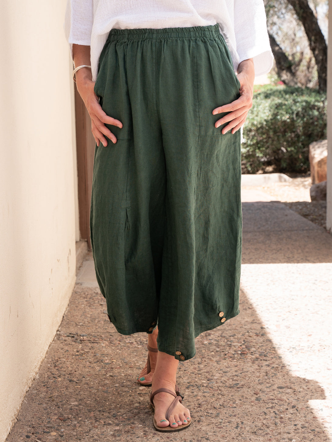 Conscious Coterie Yoli Linen Pant in Forest Green on model front view