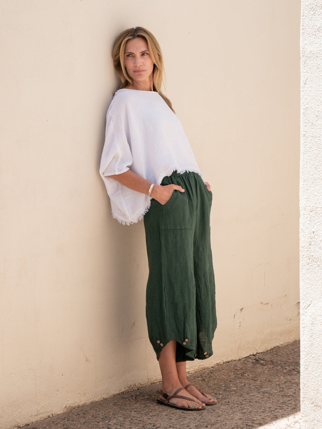 Conscious Coterie Yoli Linen Pant in Forest Green on model looking right full front view